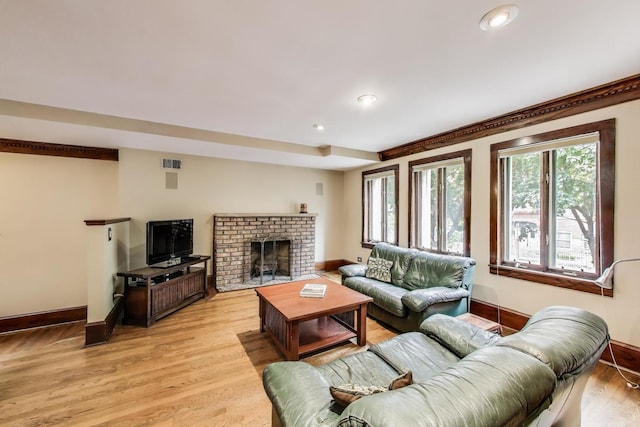 3215 S Calumet Ave, Chicago, IL 60616 - living area with light wood-style flooring, recessed lighting, and a brick fireplace