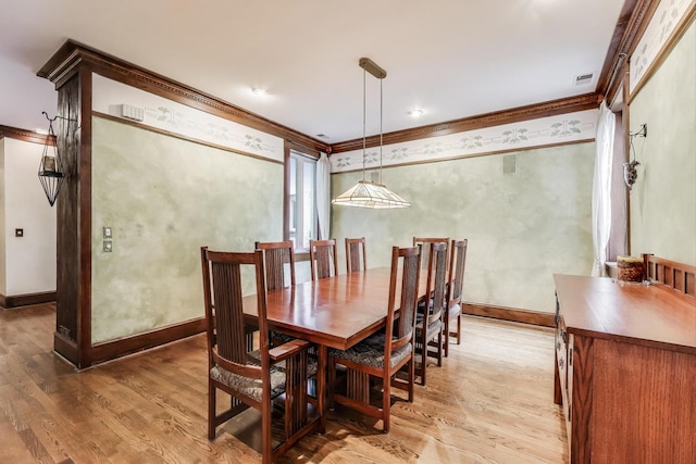 3215 S Calumet Ave, Chicago, IL 60616 - dining area featuring ornamental molding and light wood-style floors
