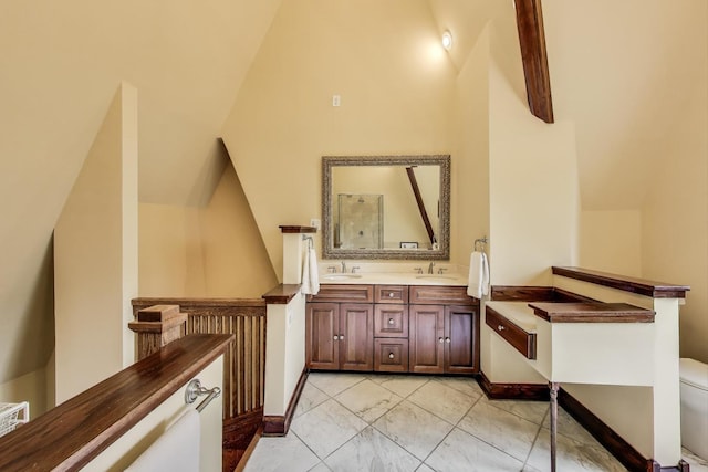 3215 S Calumet Ave, Chicago, IL 60616 - full bathroom featuring double vanity, vaulted ceiling, and marble look tiles
