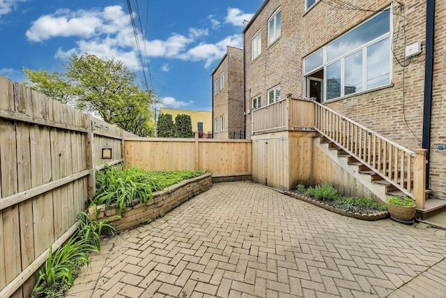 3215 S Calumet Ave, Chicago, IL 60616 - fenced backyard with a patio area and stairs