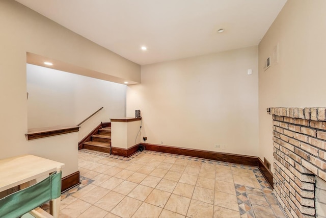 3215 S Calumet Ave, Chicago, IL 60616 - spare room with stairs, recessed lighting, and light tile patterned floors