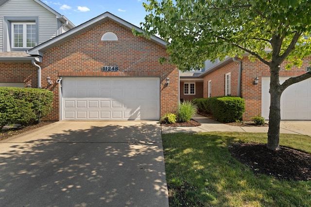 11248 Melrose Ct, Orland Park, IL 60467 - traditional home with a garage, concrete driveway, brick siding, and a front yard