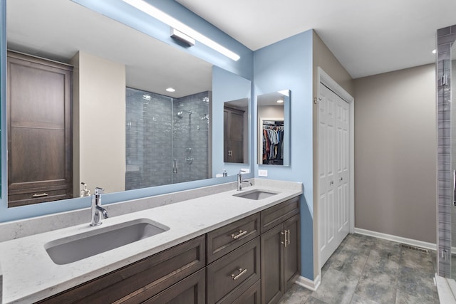 11248 Melrose Ct, Orland Park, IL 60467 - bathroom featuring a stall shower, double vanity, a walk in closet, and recessed lighting