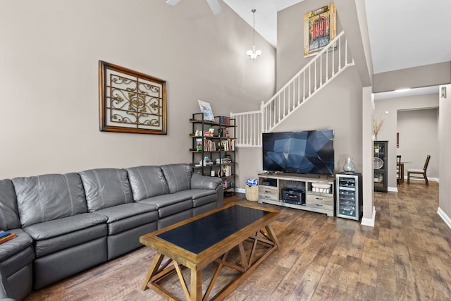 11248 Melrose Ct, Orland Park, IL 60467 - living area with wine cooler, wood-type flooring, a high ceiling, stairway, and ceiling fan