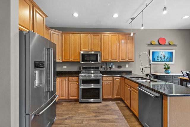 11248 Melrose Ct, Orland Park, IL 60467 - kitchen with stainless steel appliances, a peninsula, dark wood-type flooring, dark stone counters, and recessed lighting