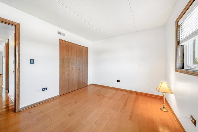 16719 Paxton Ave Unit 2S, Tinley Park, IL 60477 - unfurnished bedroom featuring light wood finished floors and a closet