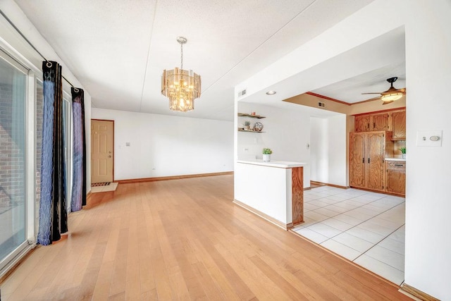16719 Paxton Ave Unit 2S, Tinley Park, IL 60477 - unfurnished room with light wood-style floors, a chandelier, and a ceiling fan