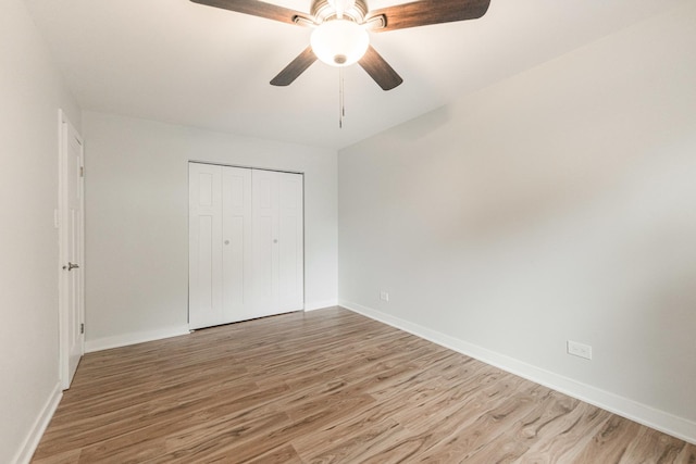 407 James Ct Unit D, Glendale Heights, IL 60139 - unfurnished bedroom featuring wood finished floors, a closet, and a ceiling fan