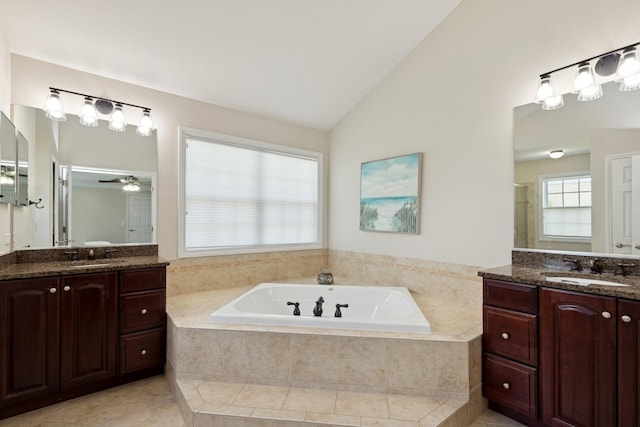 6072 Westminster Ln, Gurnee, IL 60031 - full bath featuring two vanities, a garden tub, lofted ceiling, tile patterned floors, and a ceiling fan