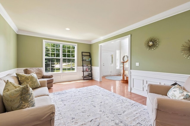 6072 Westminster Ln, Gurnee, IL 60031 - living room featuring a wainscoted wall, ornamental molding, and light wood-style floors