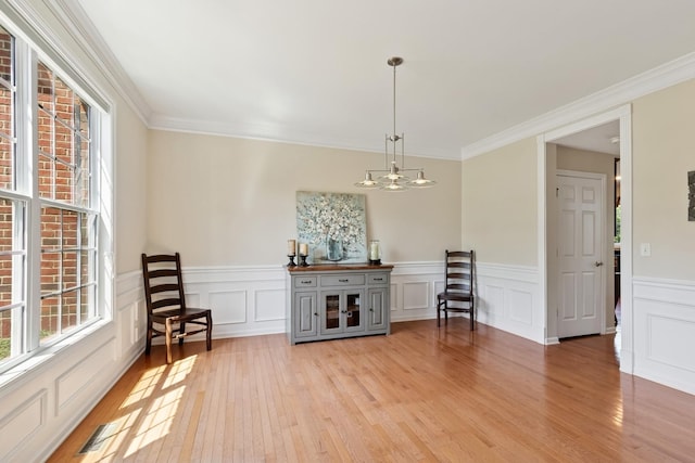 6072 Westminster Ln, Gurnee, IL 60031 - living area with a chandelier, light wood-type flooring, ornamental molding, a wainscoted wall, and a decorative wall