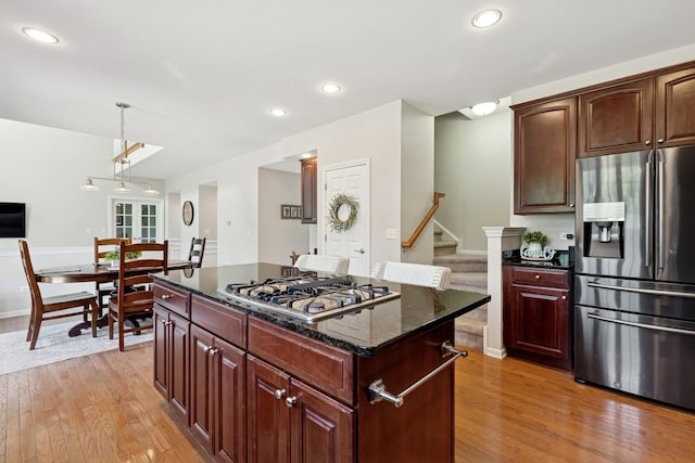 6072 Westminster Ln, Gurnee, IL 60031 - kitchen with appliances with stainless steel finishes, light wood-type flooring, a kitchen island, hanging light fixtures, and recessed lighting