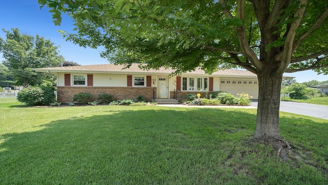 9833 Gentian Dr, Machesney Park, IL 61115 - ranch-style house with brick siding, an attached garage, a front lawn, and driveway