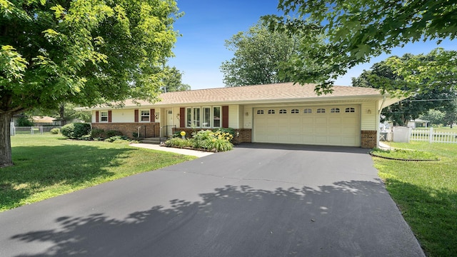 9833 Gentian Dr, Machesney Park, IL 61115 - single story home featuring brick siding, a garage, driveway, and a porch