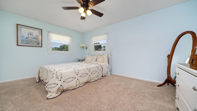 9833 Gentian Dr, Machesney Park, IL 61115 - carpeted bedroom featuring baseboards and a ceiling fan