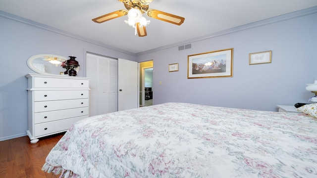 9833 Gentian Dr, Machesney Park, IL 61115 - bedroom featuring ornamental molding, dark wood-style flooring, a closet, and a ceiling fan
