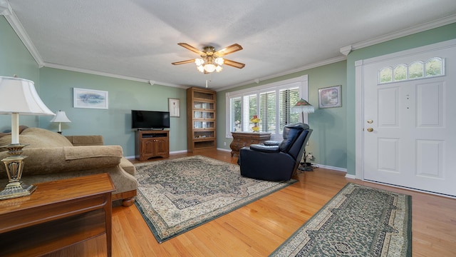 9833 Gentian Dr, Machesney Park, IL 61115 - living area with a ceiling fan, ornamental molding, wood finished floors, and a textured ceiling