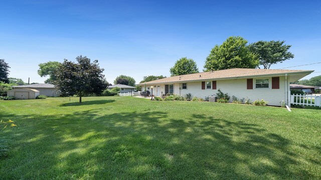 9833 Gentian Dr, Machesney Park, IL 61115 - view of yard featuring a storage shed