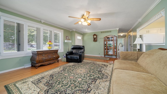 9833 Gentian Dr, Machesney Park, IL 61115 - living area with wood finished floors, ceiling fan, and ornamental molding