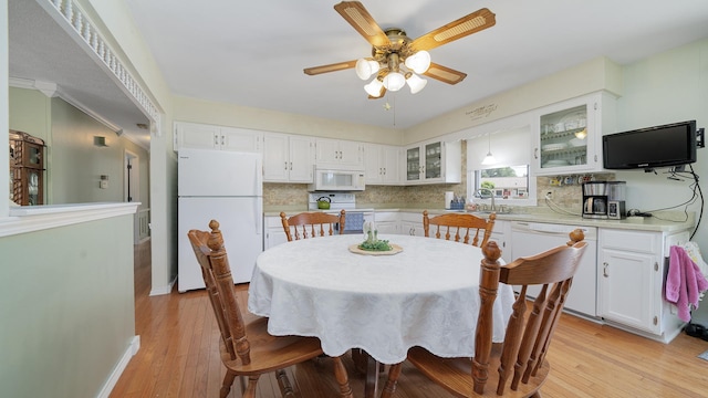 9833 Gentian Dr, Machesney Park, IL 61115 - dining area featuring ceiling fan, light wood-style flooring, and crown molding