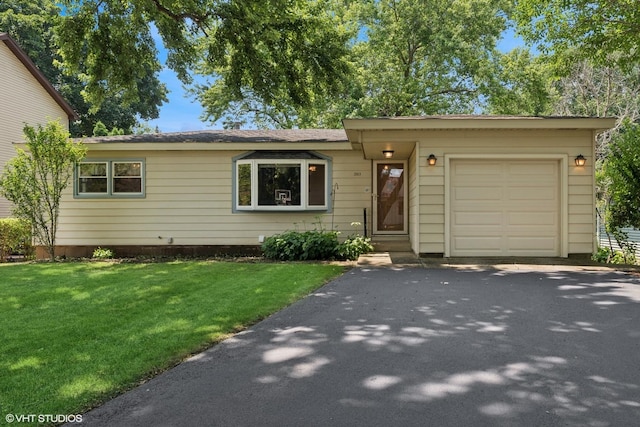 3513 Woodland Cir, Island Lake, IL 60042 - ranch-style home with an attached garage, a front lawn, and driveway