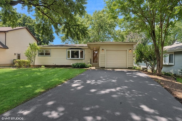 3513 Woodland Cir, Island Lake, IL 60042 - view of front of house featuring a garage, driveway, and a front yard