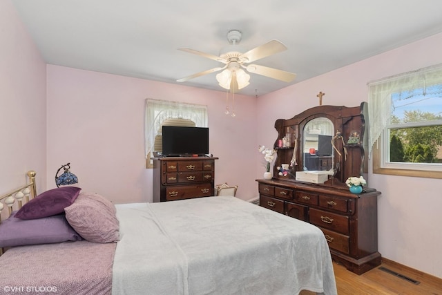 3513 Woodland Cir, Island Lake, IL 60042 - bedroom featuring wood finished floors and a ceiling fan