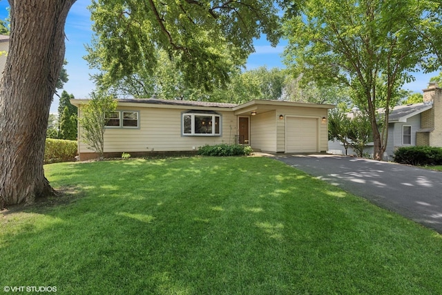 3513 Woodland Cir, Island Lake, IL 60042 - ranch-style home featuring a garage, driveway, and a front lawn