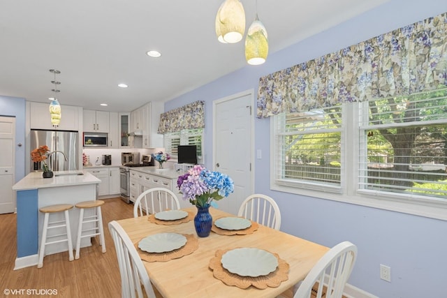 3513 Woodland Cir, Island Lake, IL 60042 - dining area featuring light wood-style floors and recessed lighting