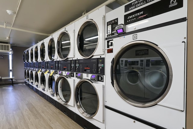 3550 N Lake Shore Dr Unit 2616, Chicago, IL 60657 - community laundry room with stacked washer / drying machine, washer and clothes dryer, and wood finished floors