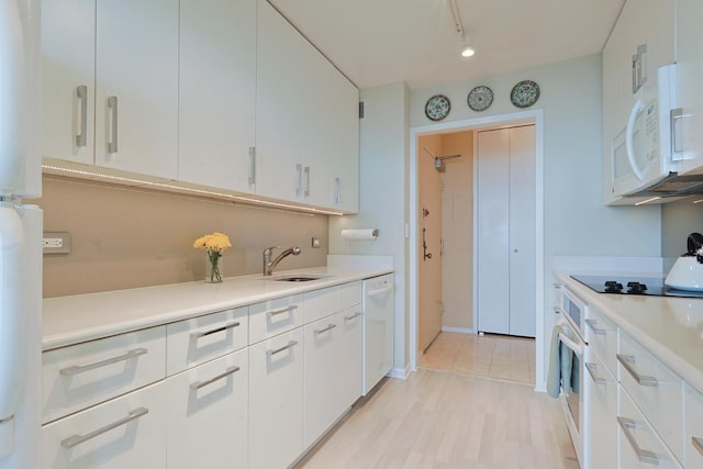 3550 N Lake Shore Dr Unit 2616, Chicago, IL 60657 - kitchen featuring white appliances, light countertops, and white cabinetry