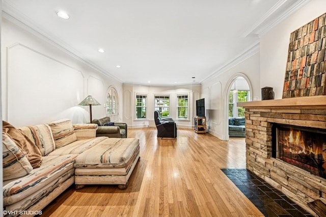 311 3rd St, Wilmette, IL 60091 - living area featuring a stone fireplace, ornamental molding, wood finished floors, and recessed lighting