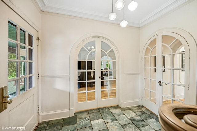 311 3rd St, Wilmette, IL 60091 - entryway featuring french doors, ornamental molding, arched walkways, and stone finish floors