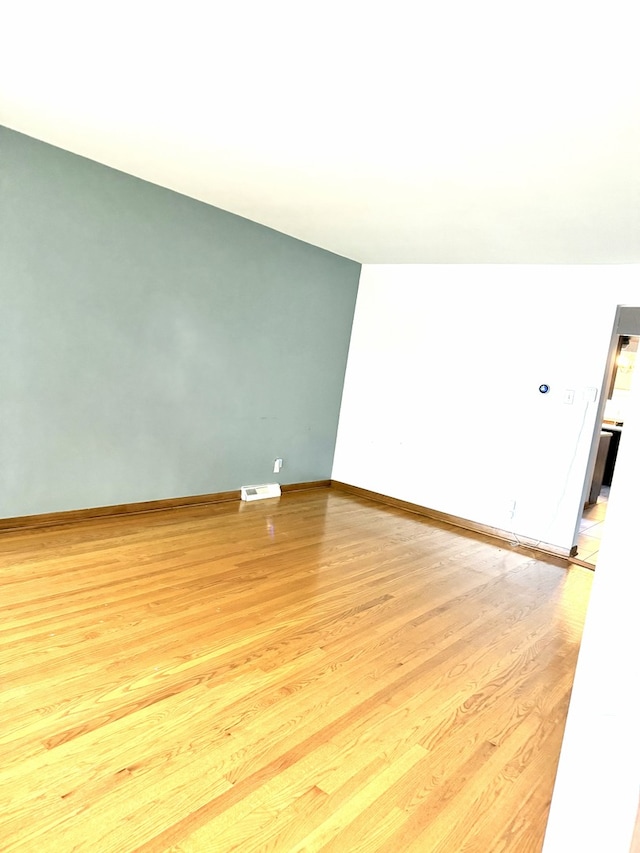 6023 W 64th St, Chicago, IL 60638 - empty room featuring light wood-style flooring and baseboards