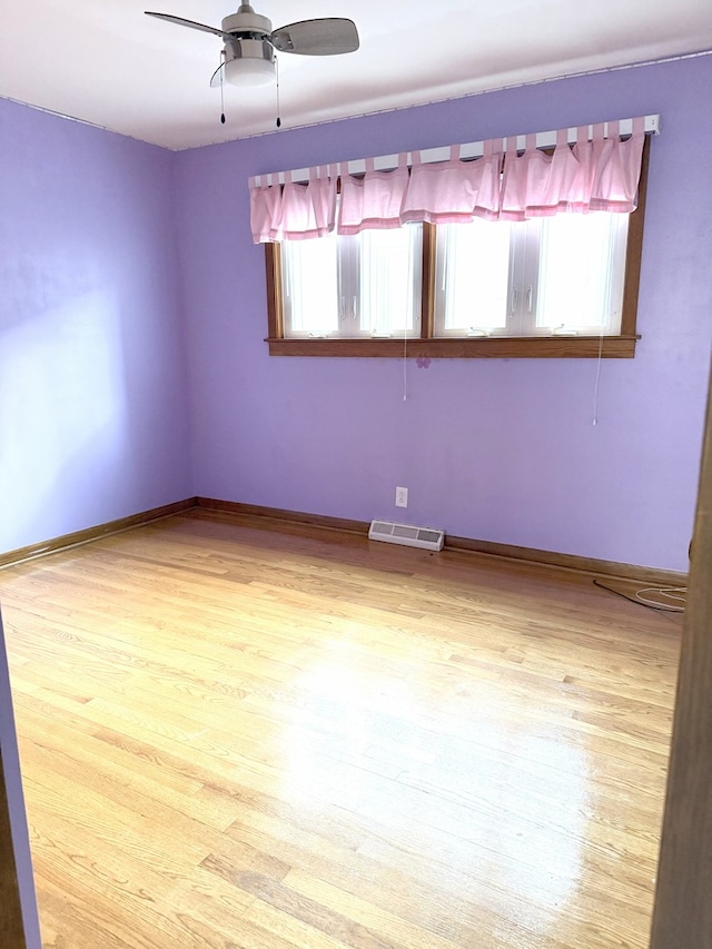 6023 W 64th St, Chicago, IL 60638 - unfurnished room featuring healthy amount of natural light, a ceiling fan, and light wood-type flooring