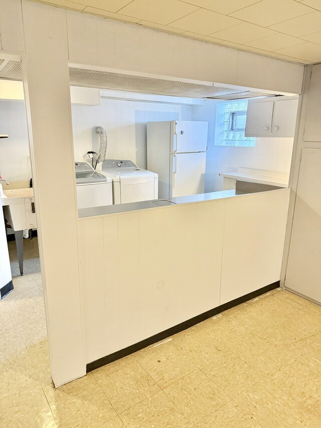 6023 W 64th St, Chicago, IL 60638 - kitchen with freestanding refrigerator, separate washer and dryer, and light floors