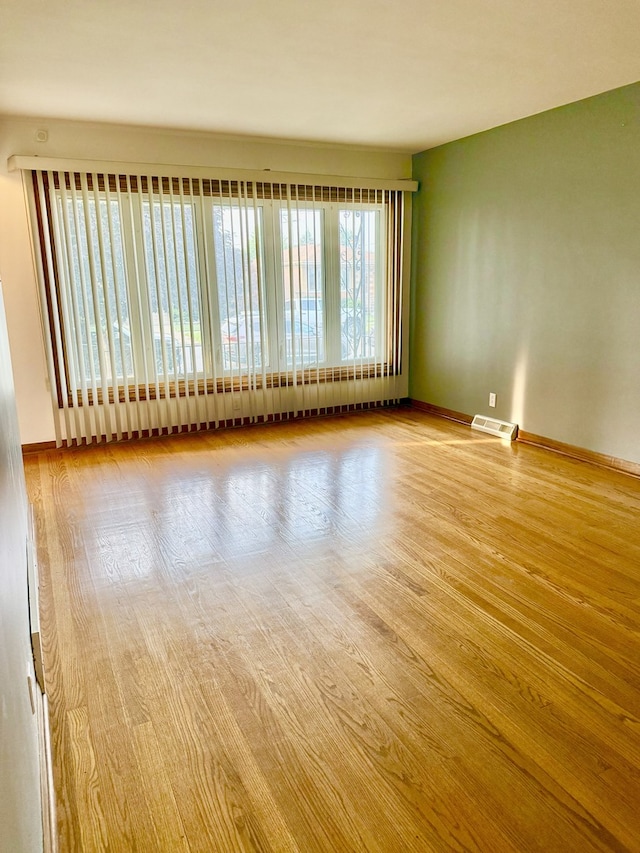 6023 W 64th St, Chicago, IL 60638 - unfurnished room with baseboards and wood finished floors