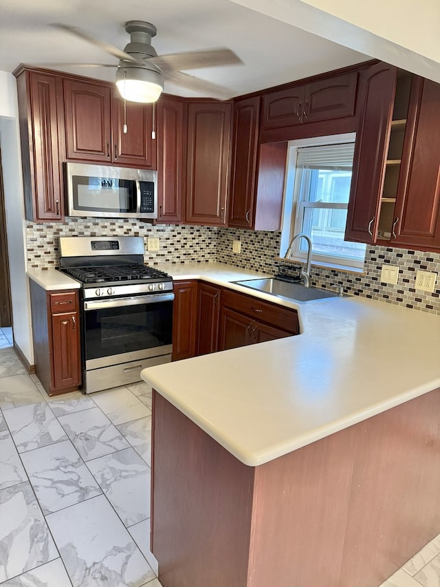 6023 W 64th St, Chicago, IL 60638 - kitchen featuring appliances with stainless steel finishes, light marble finish flooring, light countertops, a ceiling fan, and decorative backsplash