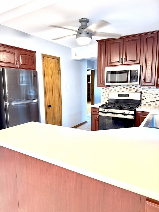 6023 W 64th St, Chicago, IL 60638 - kitchen with appliances with stainless steel finishes, light countertops, tasteful backsplash, and ceiling fan