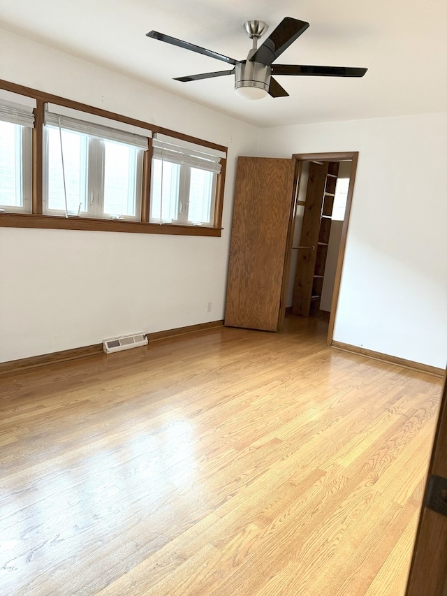 6023 W 64th St, Chicago, IL 60638 - empty room featuring a ceiling fan and wood finished floors