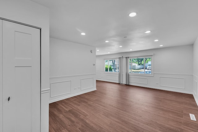 246 Gentry St, Park Forest, IL 60466 - unfurnished room with recessed lighting, a decorative wall, wainscoting, and wood finished floors