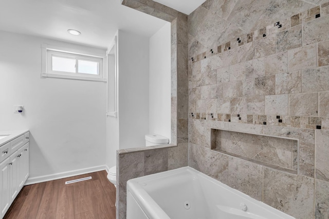 246 Gentry St, Park Forest, IL 60466 - bathroom with a tub with jets, vanity, and wood finished floors