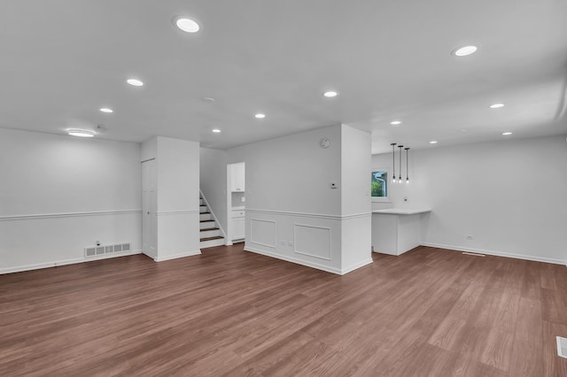 246 Gentry St, Park Forest, IL 60466 - empty room featuring recessed lighting, stairway, wood finished floors, and a smoke detector