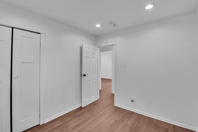 246 Gentry St, Park Forest, IL 60466 - unfurnished bedroom featuring wood finished floors, a closet, and recessed lighting