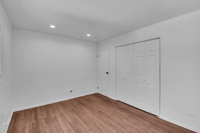 246 Gentry St, Park Forest, IL 60466 - unfurnished bedroom featuring wood finished floors, recessed lighting, and a closet
