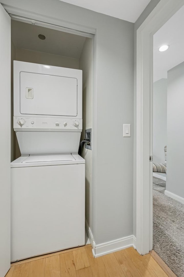 130 N Garland Ct Unit 1608, Chicago, IL 60602 - laundry room with stacked washer / drying machine and light wood-style floors