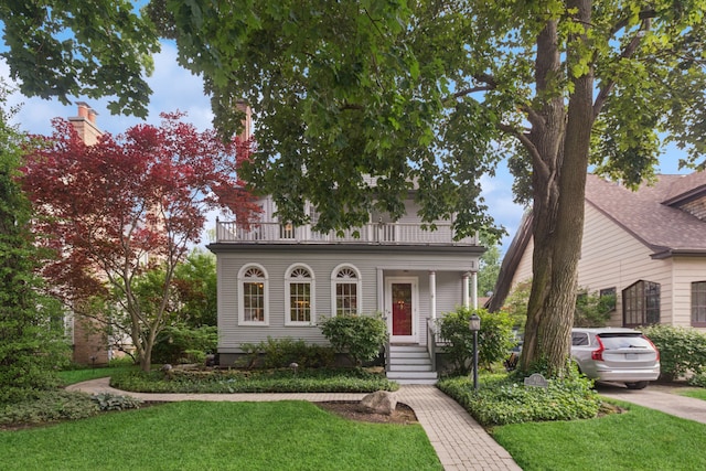 611 Lake Ave, Wilmette, IL 60091 - view of front of home with a balcony and a front yard