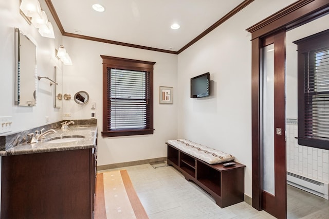 611 Lake Ave, Wilmette, IL 60091 - bathroom featuring a baseboard radiator, double vanity, recessed lighting, and crown molding