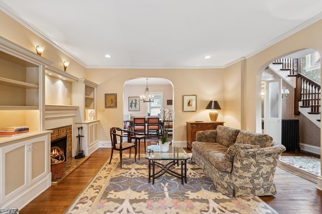 611 Lake Ave, Wilmette, IL 60091 - living area featuring arched walkways, plenty of natural light, wood finished floors, ornamental molding, and recessed lighting
