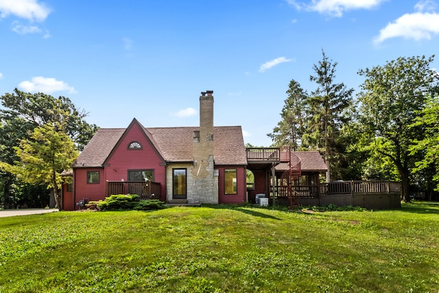 600 W Bloomingdale Rd, Itasca, IL 60143 - back of house featuring a wooden deck, a yard, a chimney, and roof with shingles